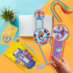 Colorful bookmarks with decorative elements on a bright background
Flat lay of folklore bookmark quilling kit with tools and bright craft materials.
