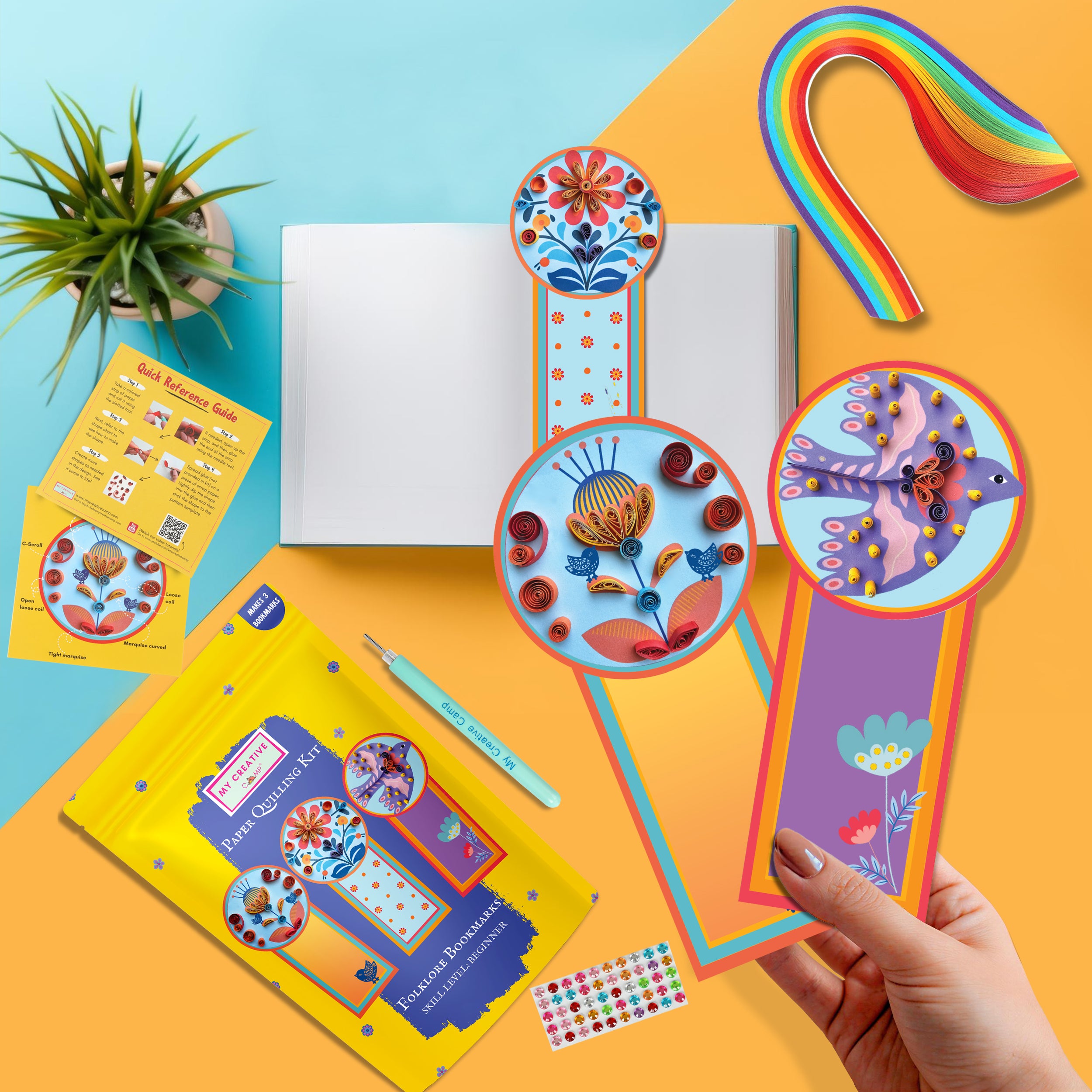 Colorful bookmarks with decorative elements on a bright background
Flat lay of folklore bookmark quilling kit with tools and bright craft materials.
