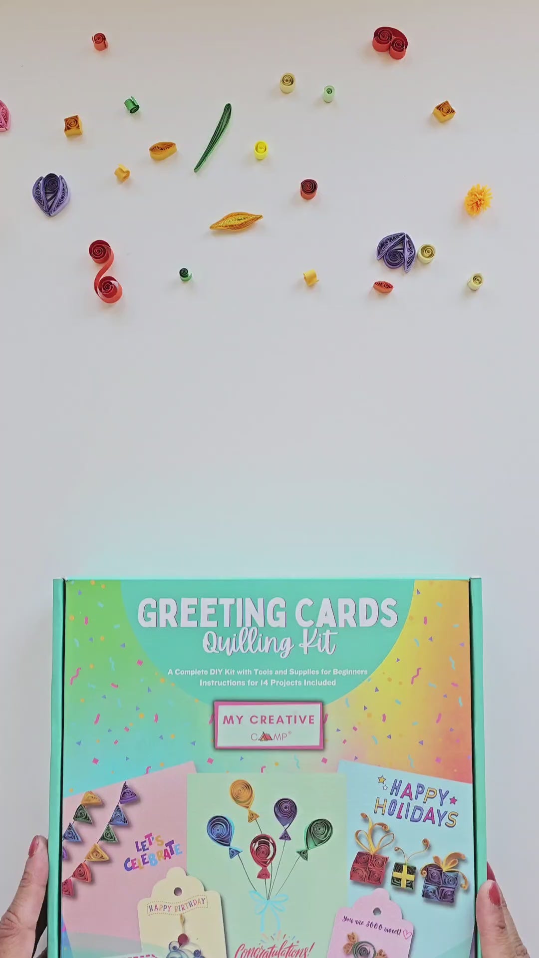 Handmade greeting cards created with a paper quilling kit featuring colorful rolled paper designs